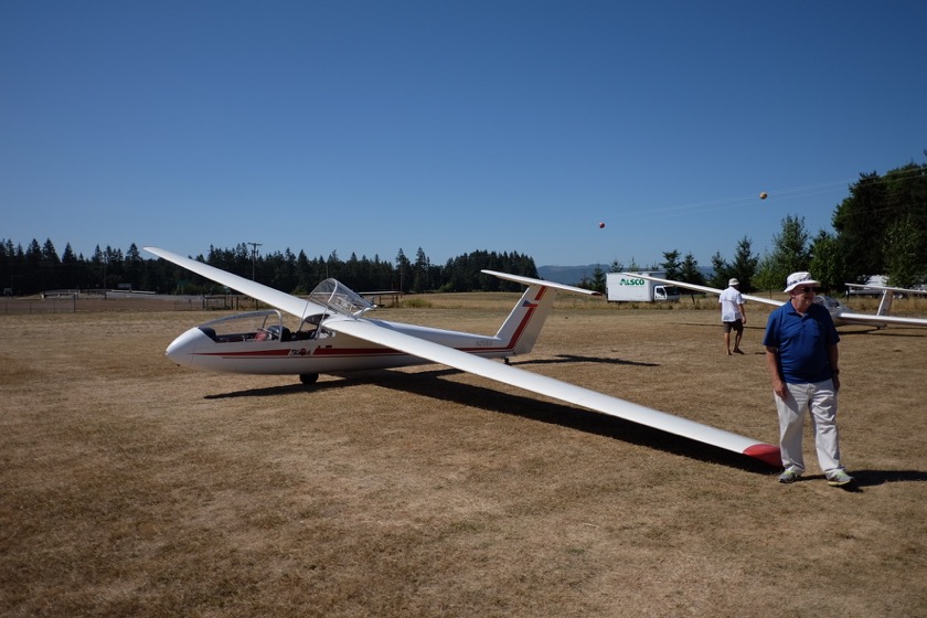 The two-seat glider we flew in. Don, the pilot, is off to the right. Note the single wheel for landing.