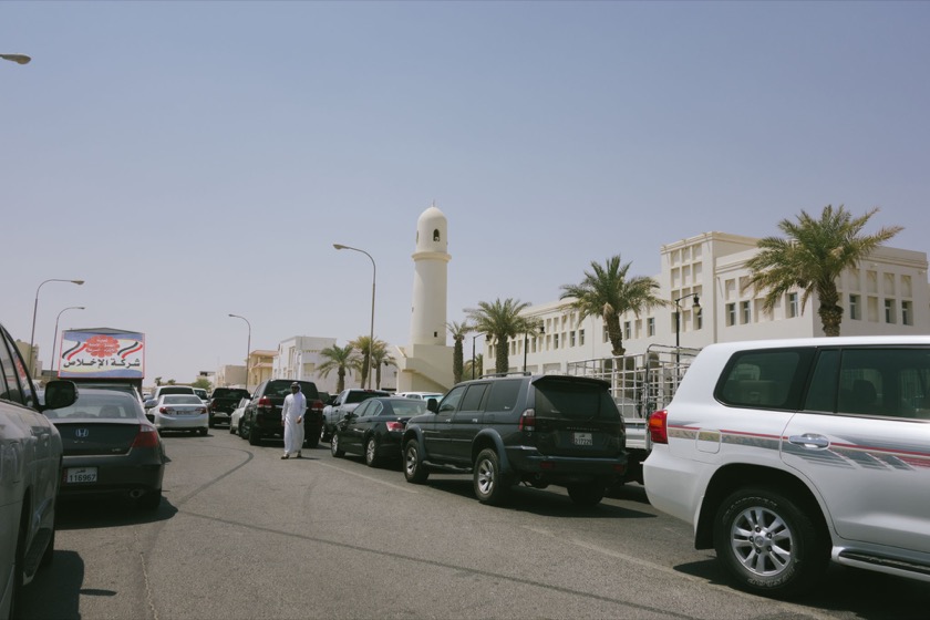 What are all these cars doing parked in the middle of the road?