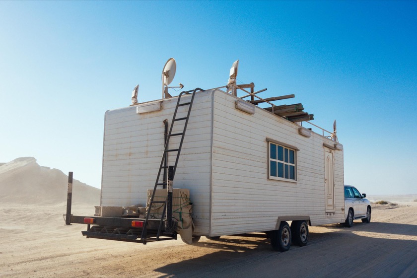 The locals invest a lot more in their camping experience than we do. We saw this trailer being towed on the dirt roads north of Zekreet.