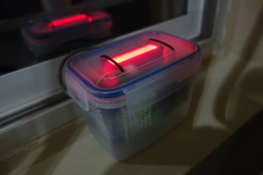 Outdoor particle sensor box with LCD screen on top, sitting on my windowsill