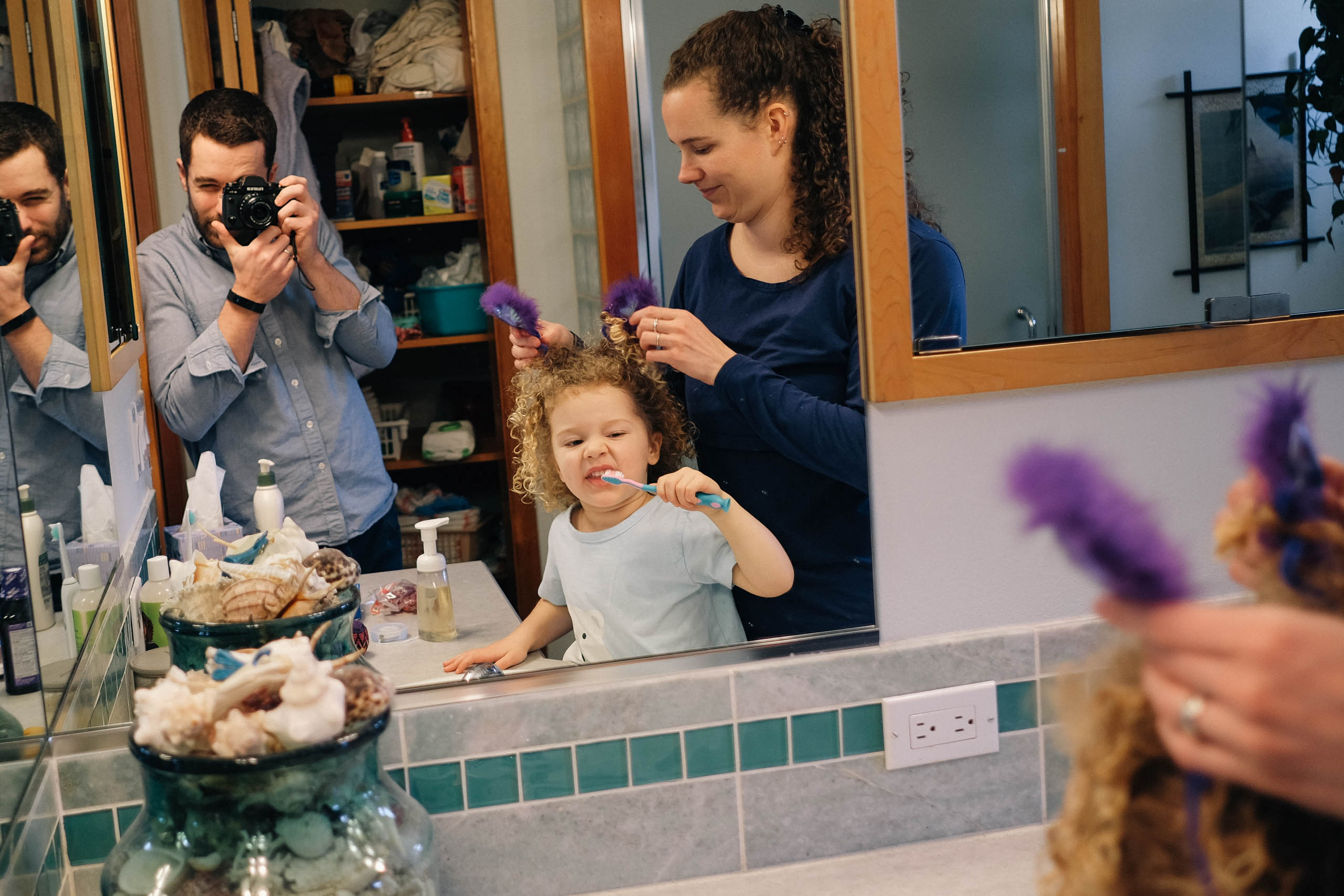 Idara brushing her teeth and Rachael fixing her hair. Eventually fixing Idara's hair is all we'll ever have time for.