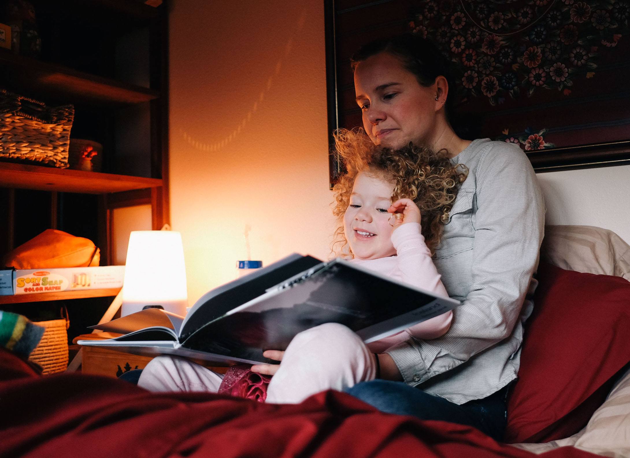 Every morning Idara and Rachael read a book in bed.