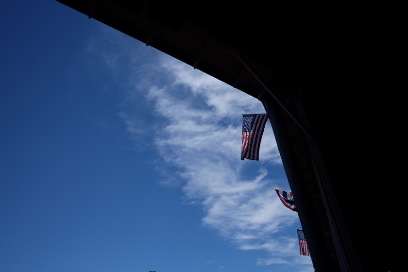 Flags in the sun at the St. Paul Rodeo grounds.